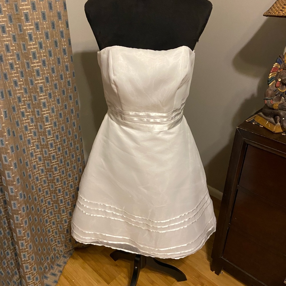 This is a white evening/prom dress David’s bridal